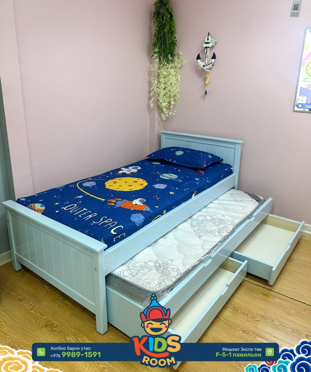 Children's bed with pull-out drawer in a room setting, featuring a 'Kids Room' brand logo.