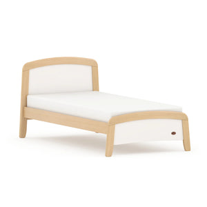 Wooden bed frame with white mattress on a white background
