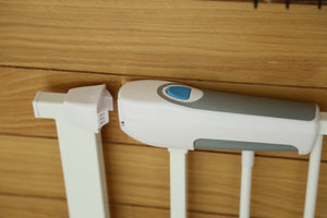 White and gray electronic device on a wooden surface