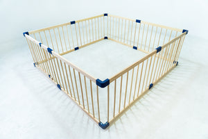Wooden playpen with blue角落 on a white background