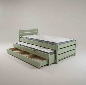 Green bed with pull-out trundle on a plain background