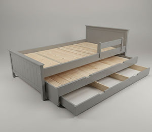 Gray wooden bed with a pull-out trundle on a gray background