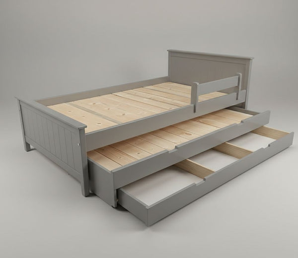 Gray wooden bed with a pull-out trundle on a gray background