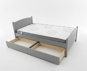 Gray bed frame with a mattress and open drawers on a white background