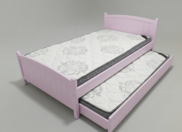 Pink bed with a mattress and trundle on a gray background