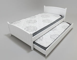 White bed with a mattress and pull-out trundle on a gray background