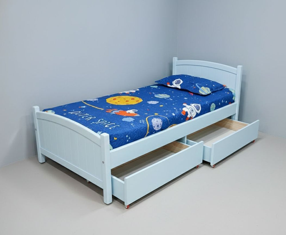 Children's bedroom with two beds, one featuring a dog-themed quilt and the other with a space-themed quilt.