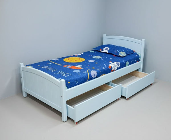 Children's bed with space-themed mattress and pull-out drawer against a gray wall.