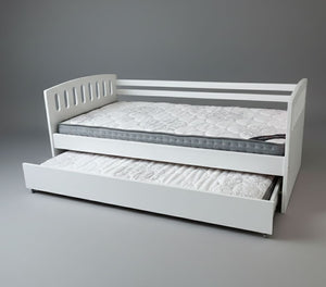 White bed with pull-out trundle on a gray background