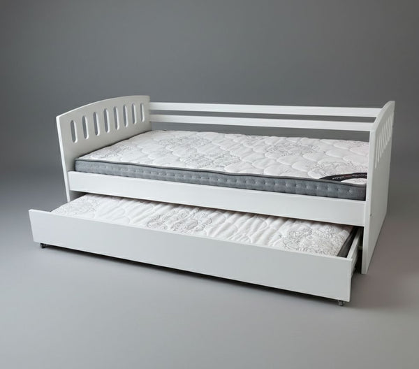 White bed with pull-out trundle on a gray background