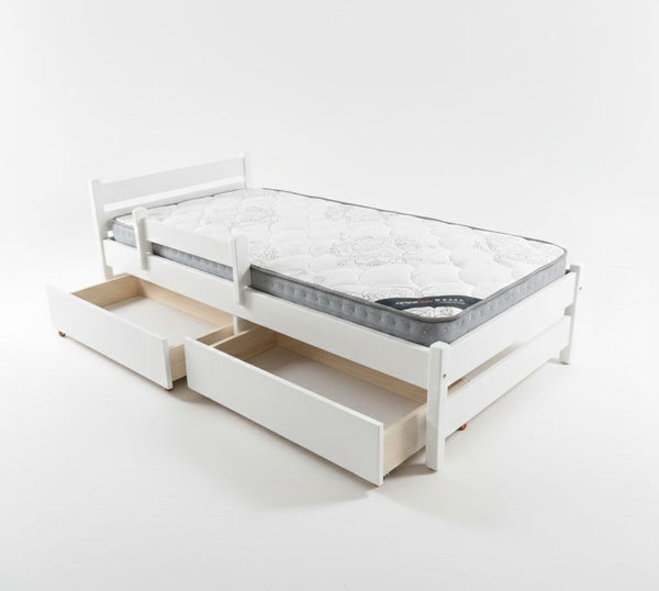 White bed frame with storage drawers and mattress on a white background