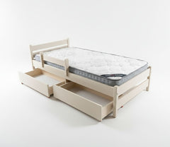 Beige bed frame with mattress and storage drawers on a white background