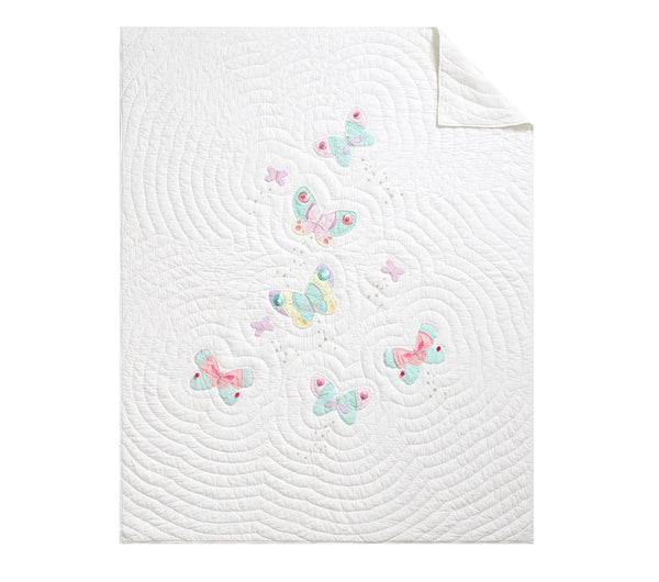 White quilt with colorful butterfly patterns on a white background