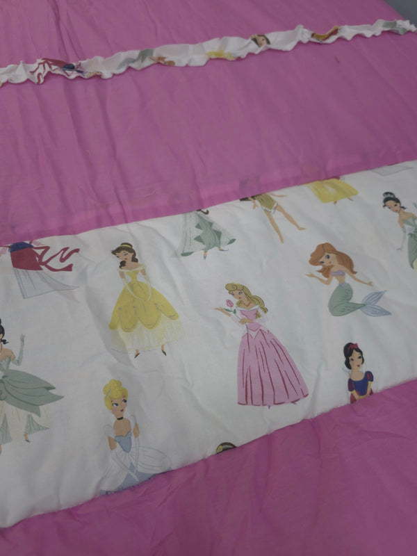 Bedding set with princess designs on a pink background