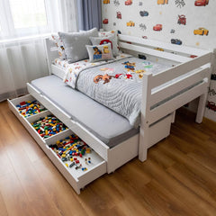 Children's bed with storage drawers filled with toys in a room with colorful car wall decals.